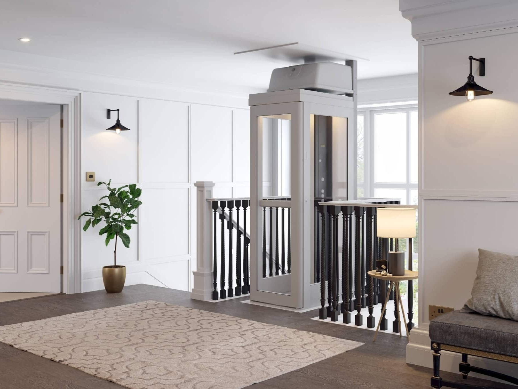 A white home elevator installed in an interior hallway, adjacent to a wooden staircase, a lamp, and a potted plant.