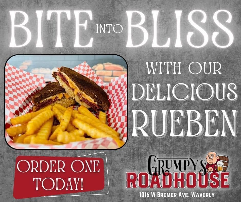 A grumpy 's roadhouse sign that says bite into bliss