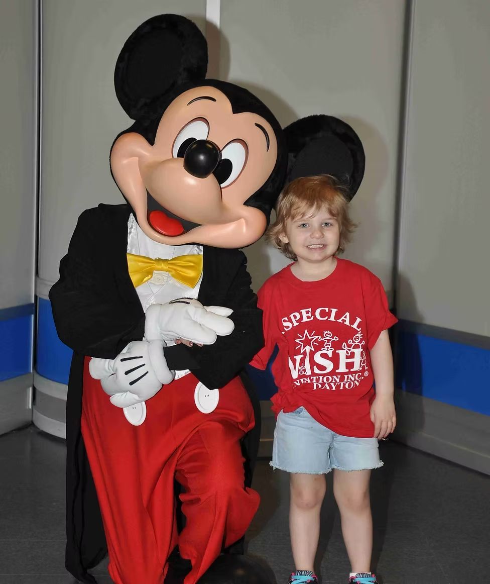 A young child in a red 