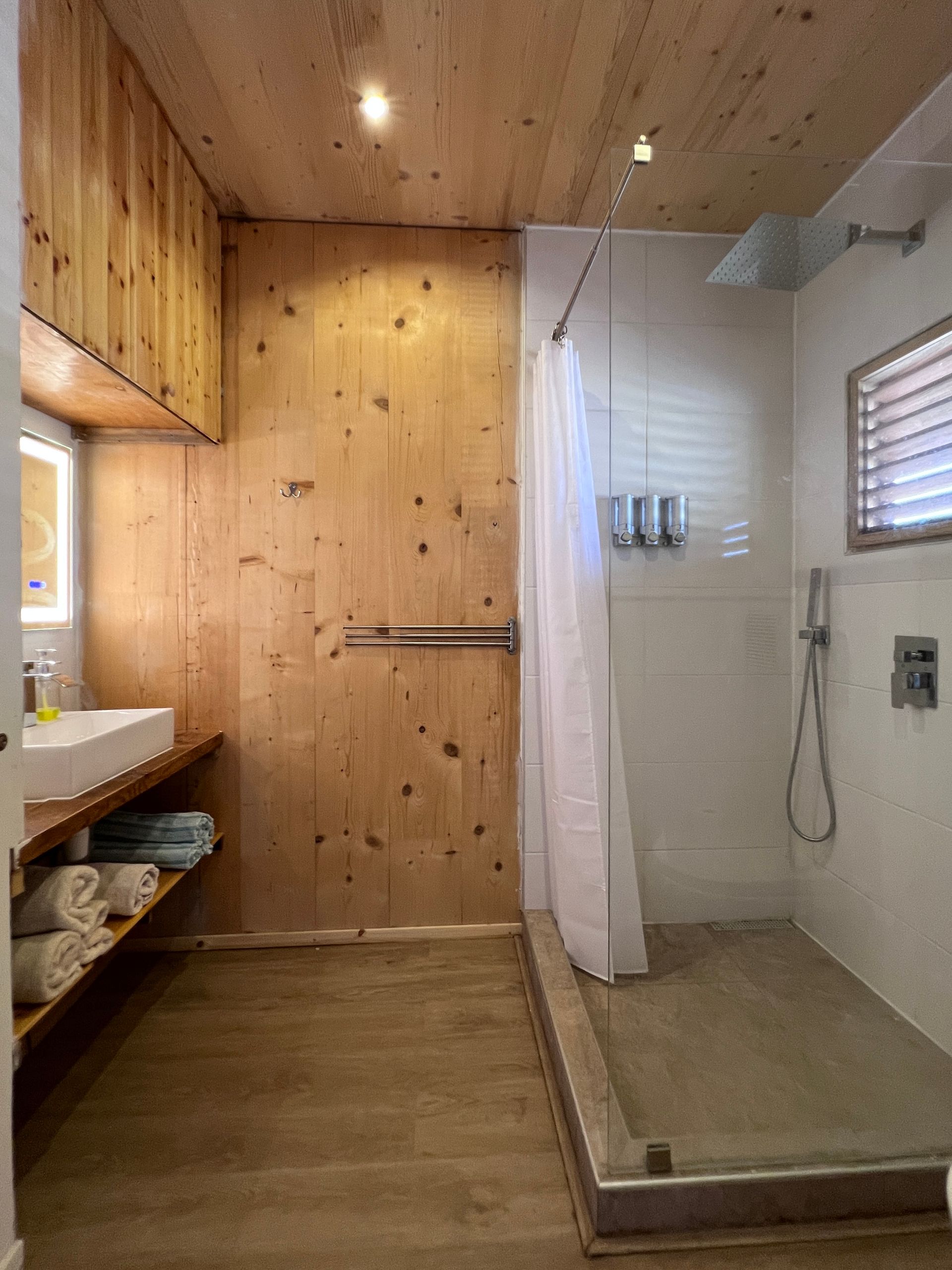 Each accommodation has its own ample private in room bathroom with a walk-in shower, bathroom supplies, toilet and a sink.