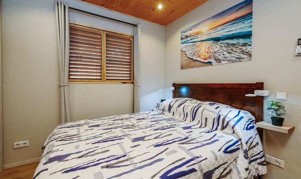 Oceanfront Suite with separate bedroom, a queen size bed, airconditioned, blackout curtains, with outside balcony