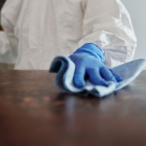 Wiping the office table — Waterbury, CT — Dependable Cleaning Service CT