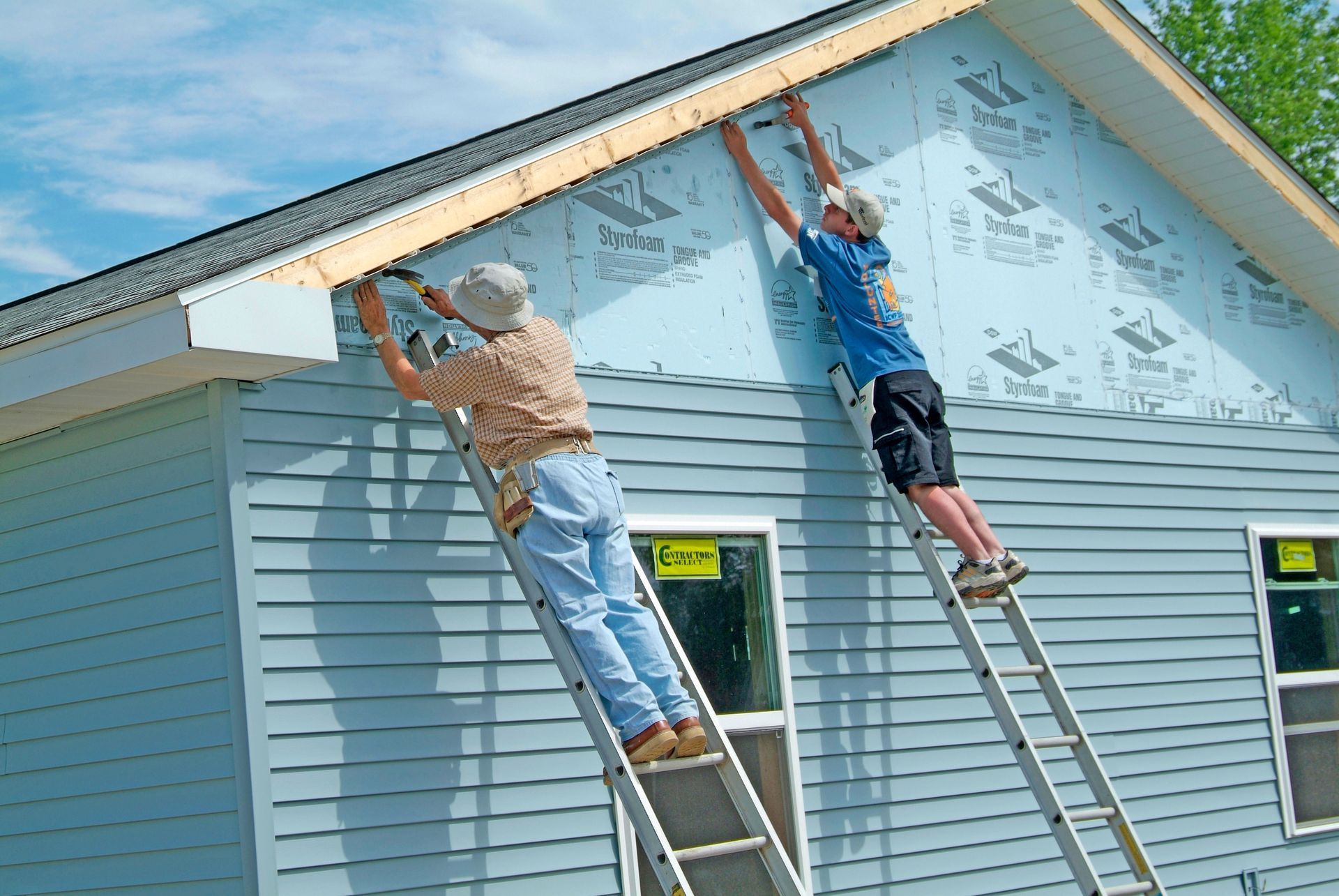 BTD Roofing team installing new sidings in Peachtree City, GA