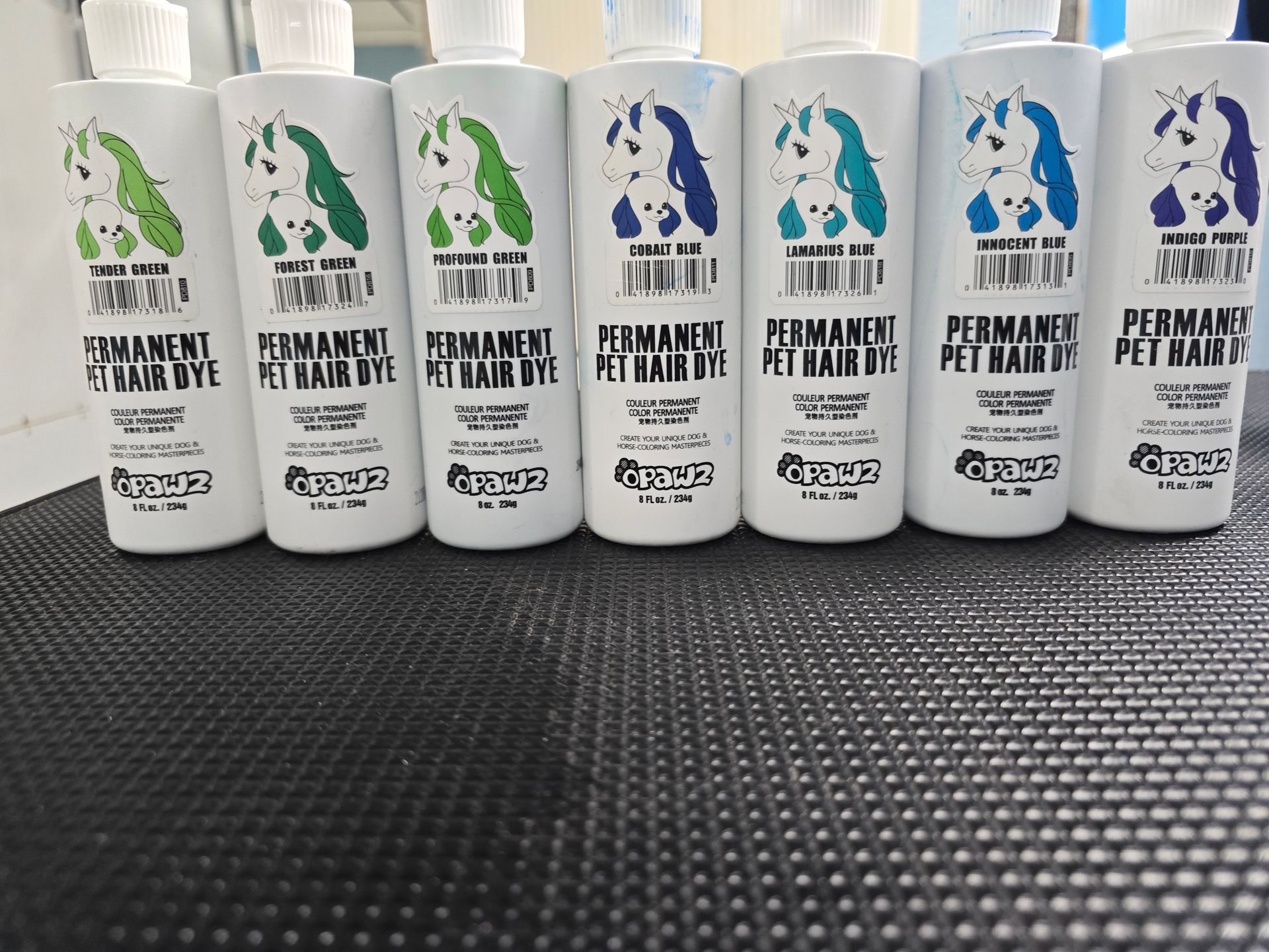 A row of bottles of permanent pet hair dye