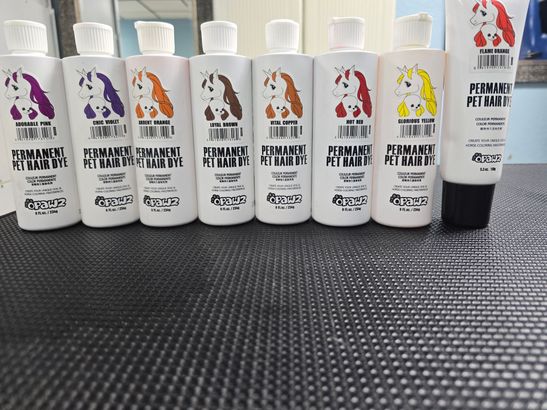A row of pet shampoo bottles are lined up on a table