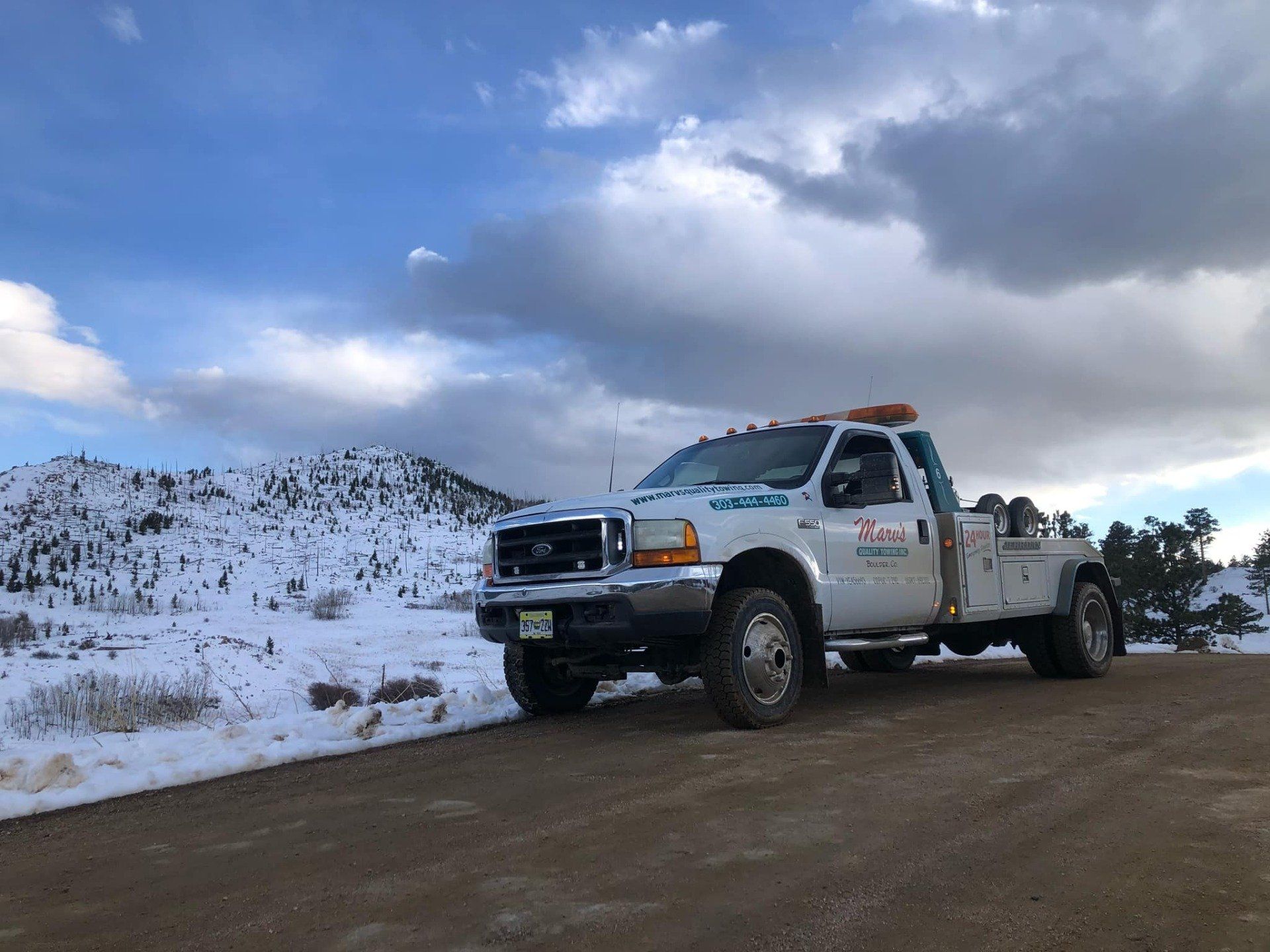 Tow Truck in Snow Area — Boulder, CO — Marv’s Quality Towing Inc