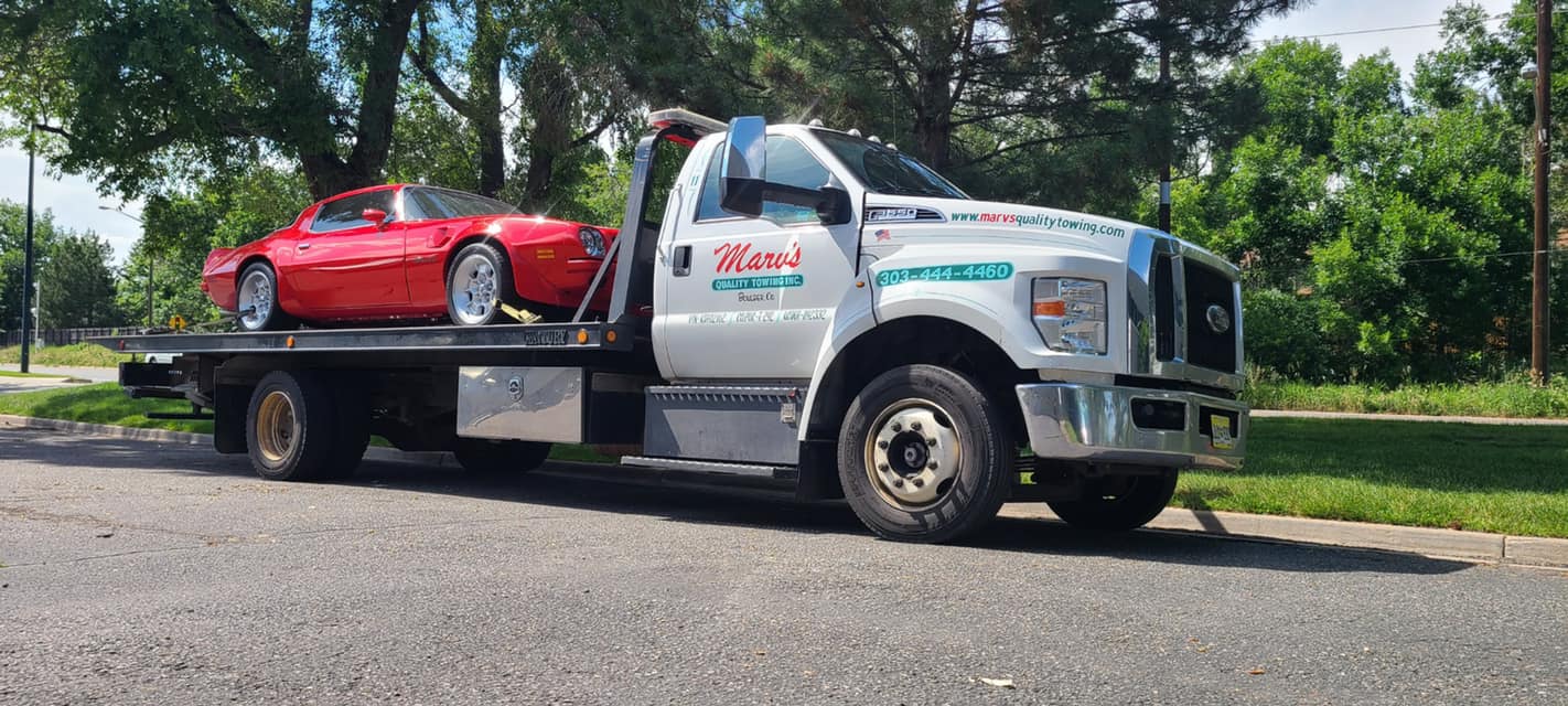 Impounding a Red Car — Boulder, CO — Marv’s Quality Towing Inc