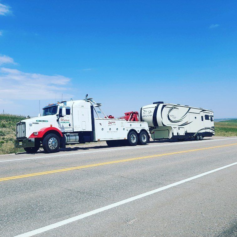 Towing Truck on Road — Boulder, CO — Marv’s Quality Towing Inc