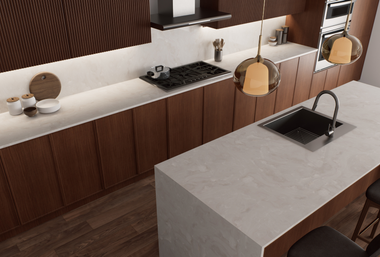 Modern kitchen with dark wood cabinetry, light grey countertops, a gas stove, kitchen island with sink, and pendant lights.