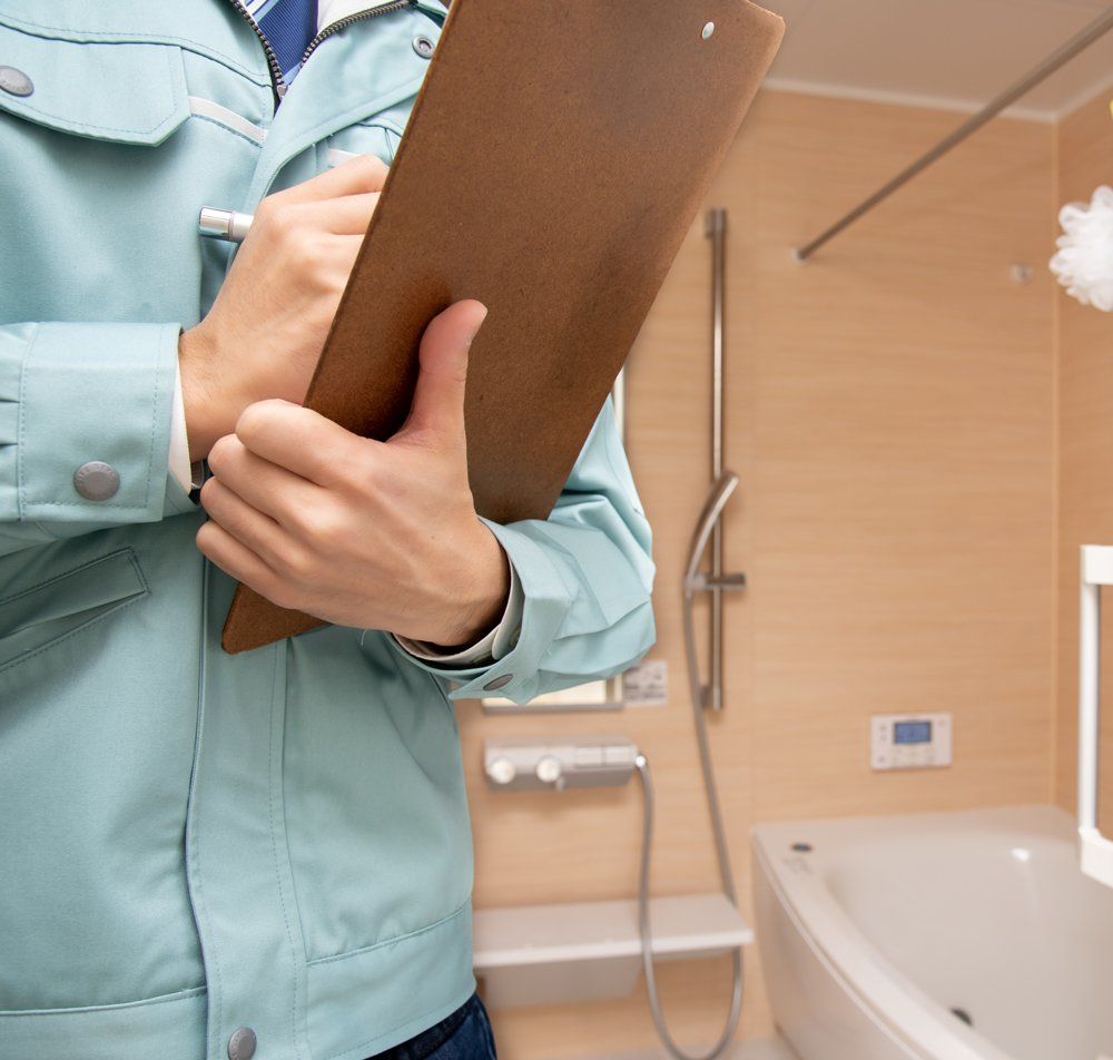 Professional Worker Inspecting Bathroom