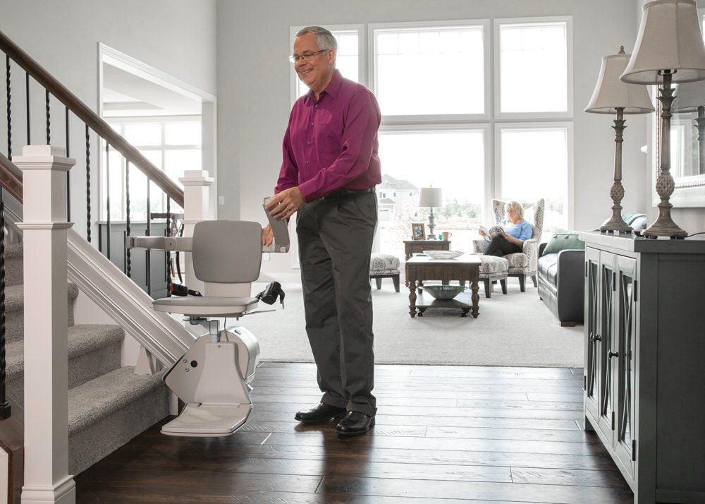 An Elder Attempting to Try a Stair Lift