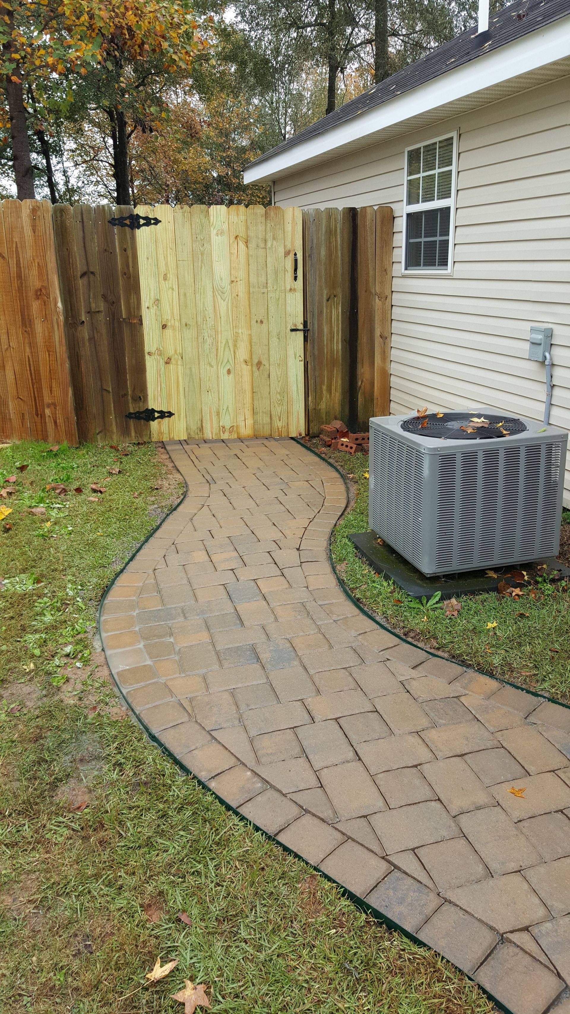 There is a fire pit in the middle of the patio with two benches.