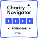 Charity Navigator Four-Star award badge, blue and white, 2025.