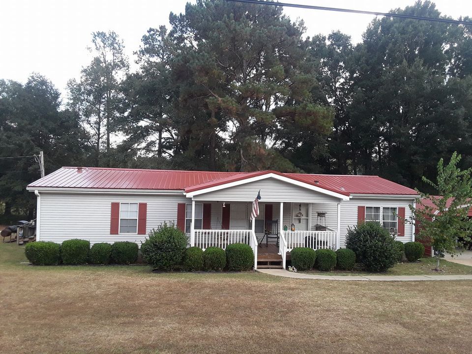 Residential House with Red Metal Roof — LaGrange, GA — Ricky Smith Roofing Inc