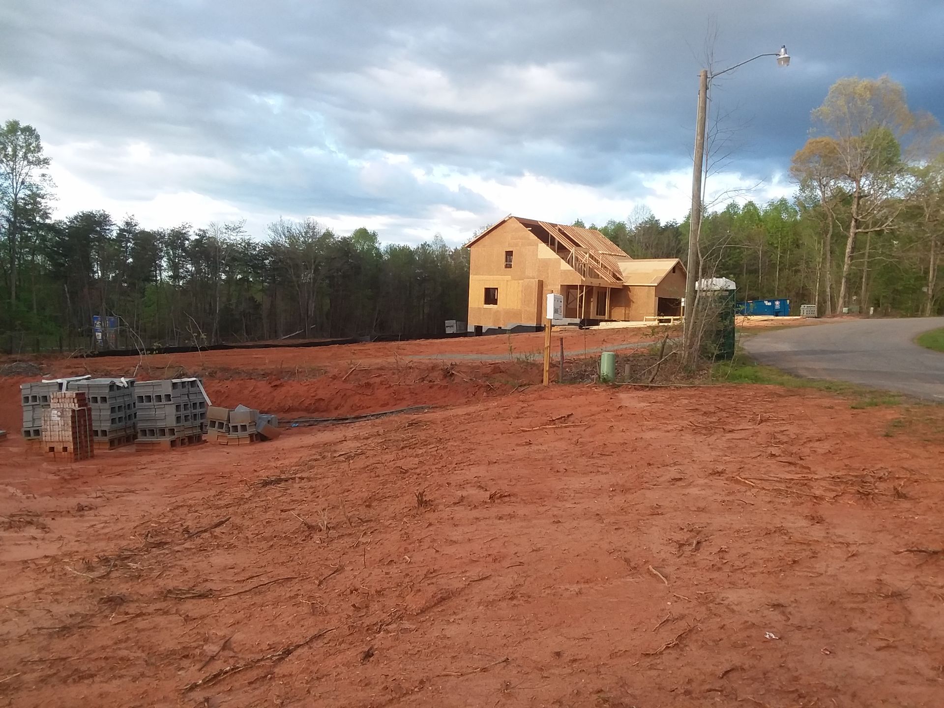 A bulldozer is working on a pile of dirt