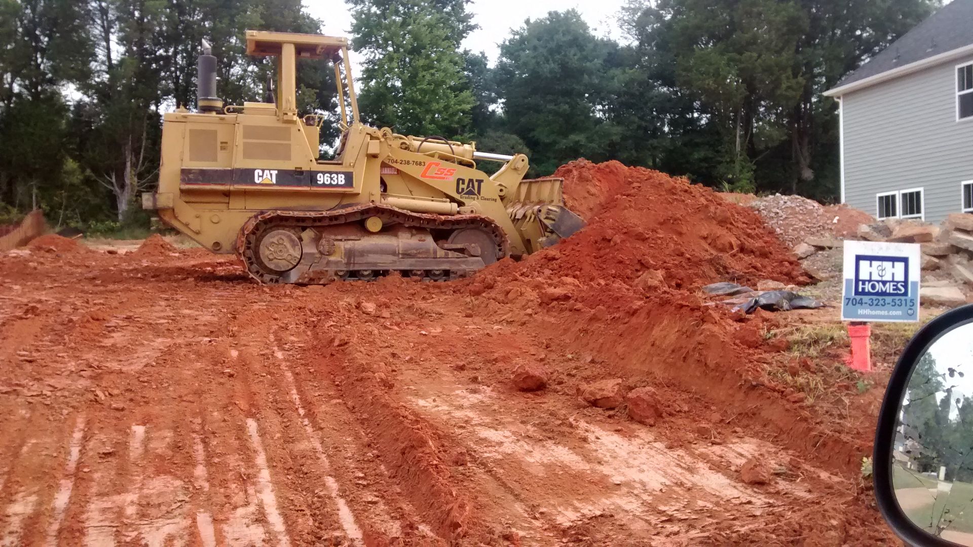 A bulldozer is moving dirt on a construction site