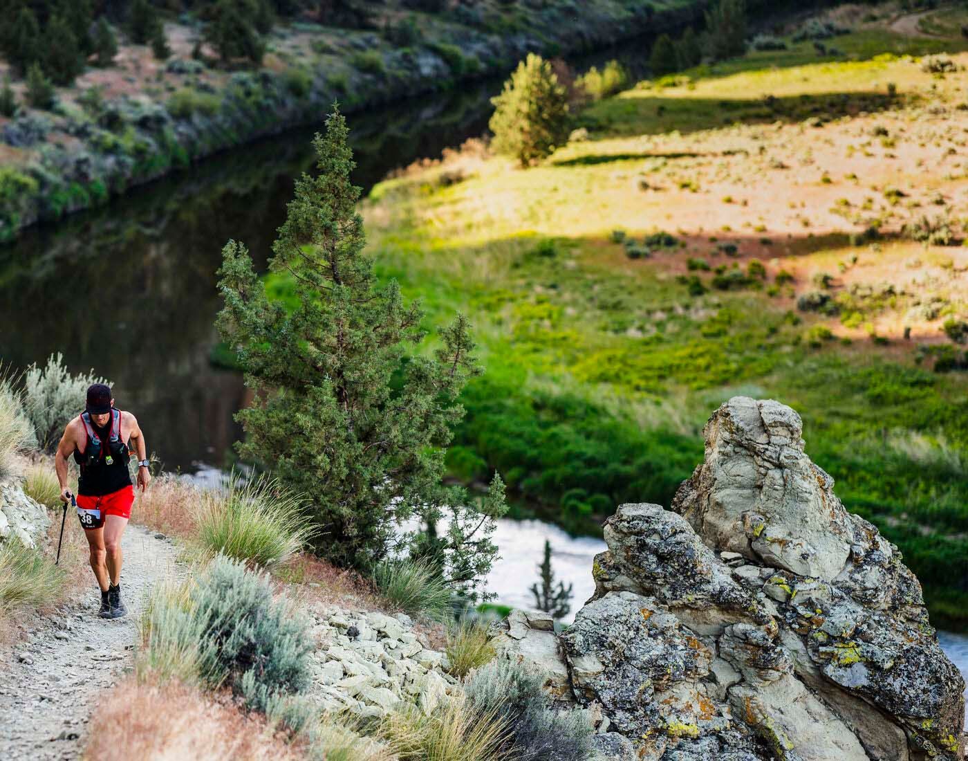 Ultramarathon runner pushing through heat and fatigue at mile 41, symbolizing resilience and leaders