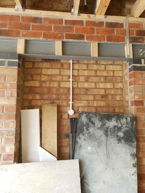 Electrical wiring on a brick wall in Leicestershire Oadby