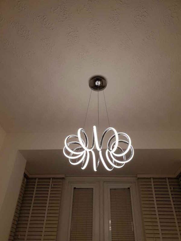 Spiral chandelier light replaced by electrician