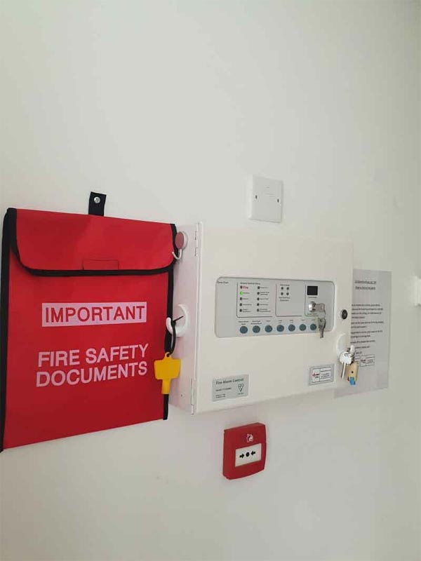Fire alarm control panel and fire safety document bag