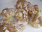 A bunch of pastries are sitting on top of each other on a table.