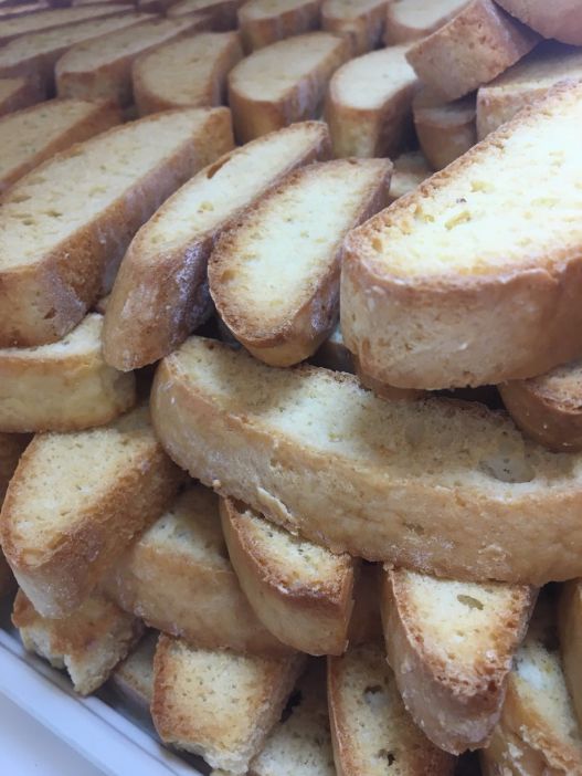 A pile of slices of bread are stacked on top of each other.