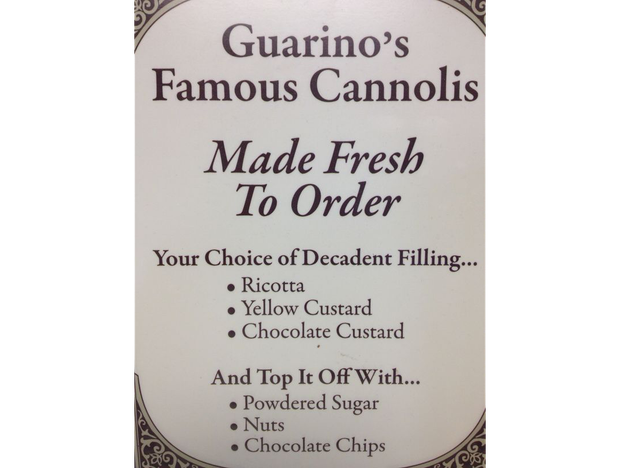 A sign that says guarino 's famous cannolis made fresh to order