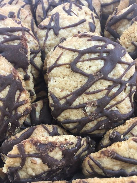 A close up of a pile of chocolate covered cookies