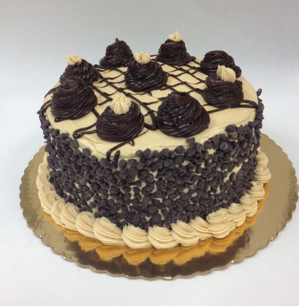 A cake with chocolate chips on top of it