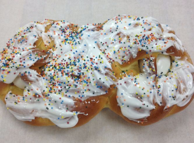A pastry with icing and sprinkles on it