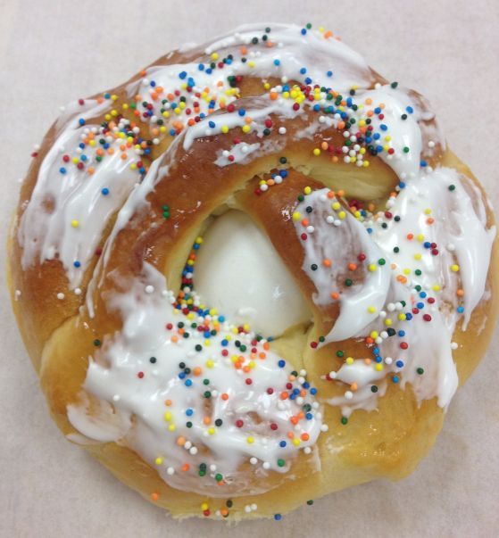 A pastry with icing and sprinkles on it