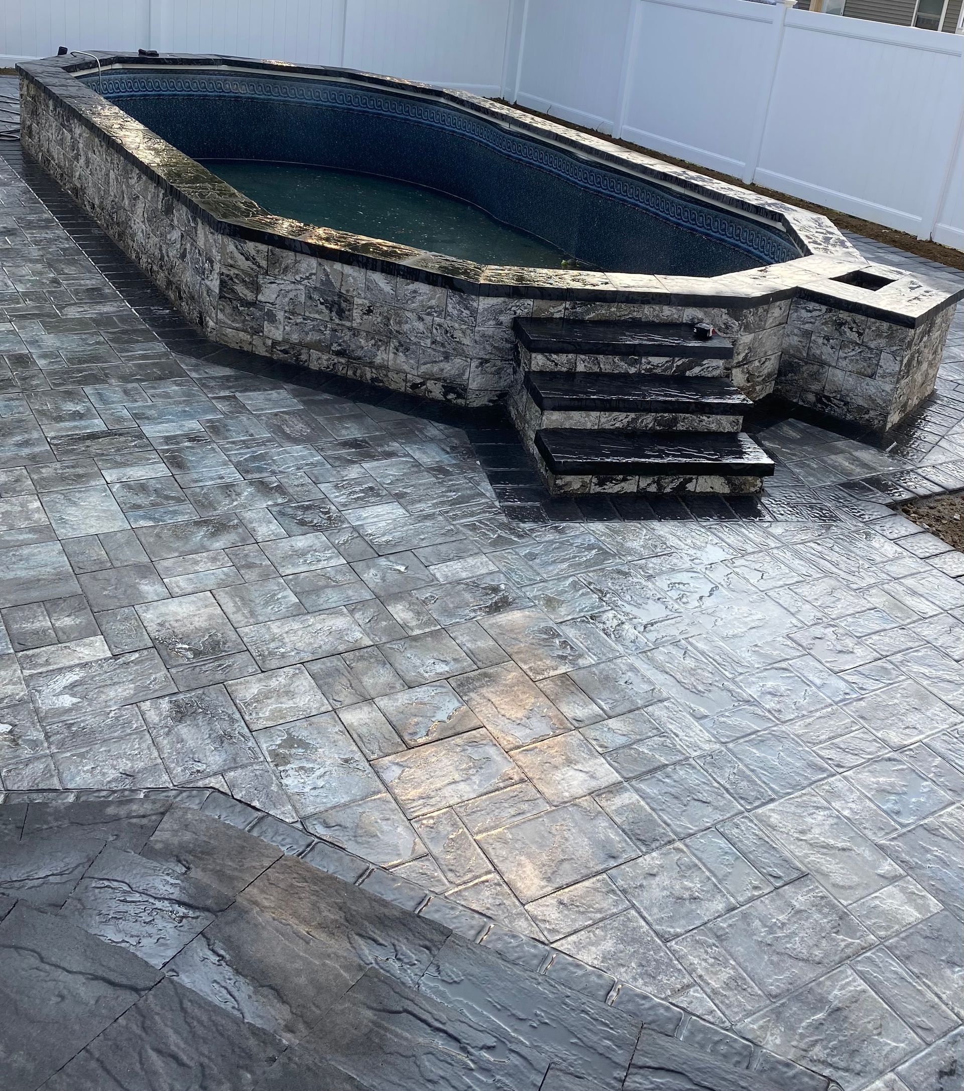 Pool Surrounded By A Stone Patio — Staten Island, NY — J. Molfino Masonry