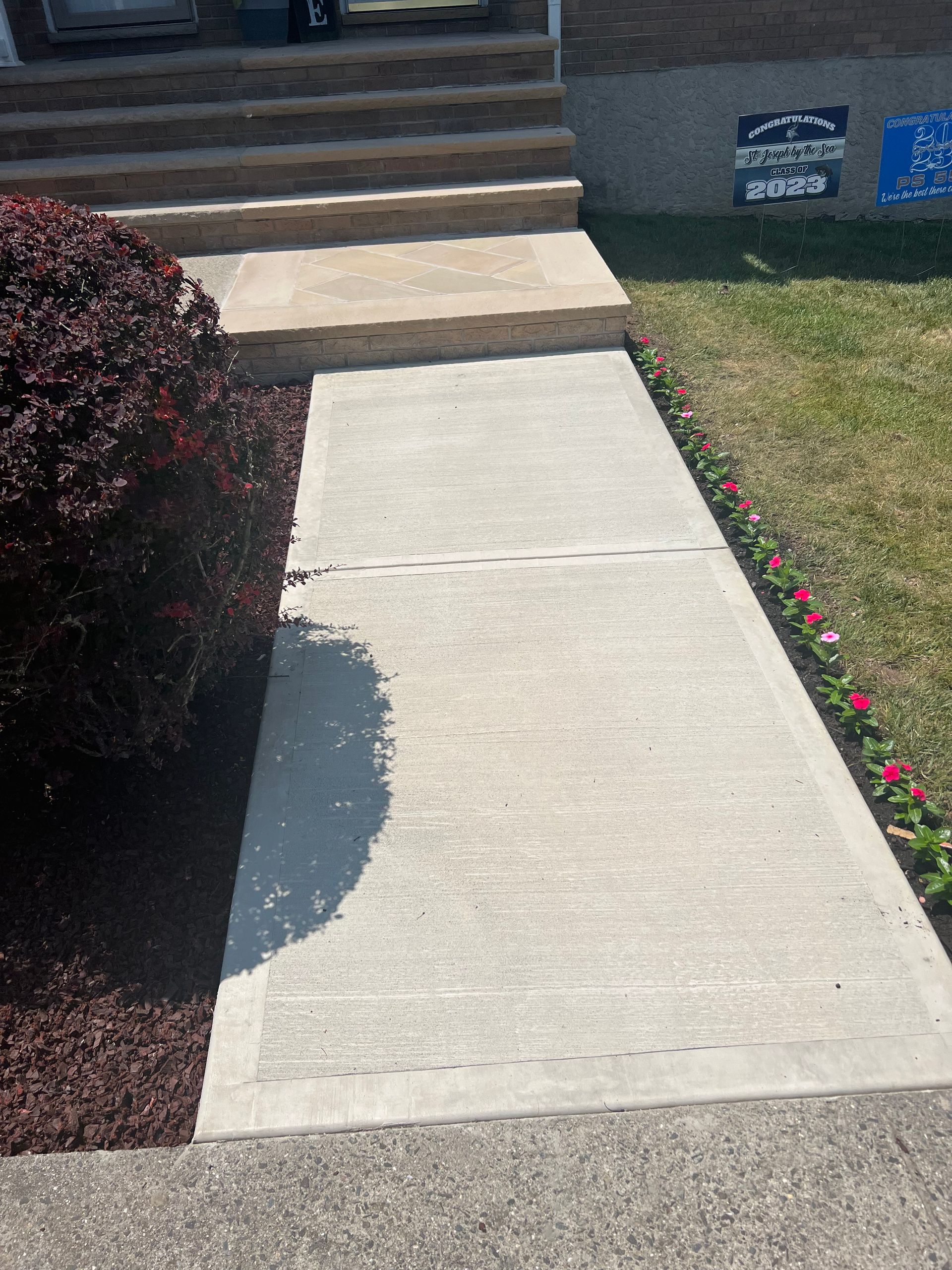 A Colorful Sidewalk Bordered by Blossoming Flowers — Staten Island, NY — J. Molfino Masonry