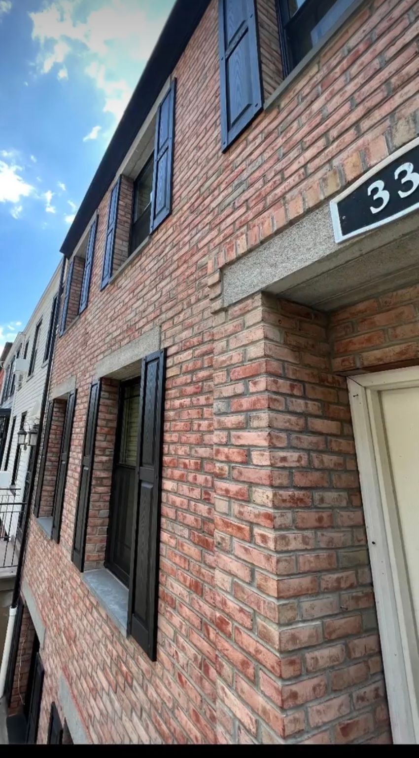 Brick Building With Shutters — Staten Island, NY — J. Molfino Masonry