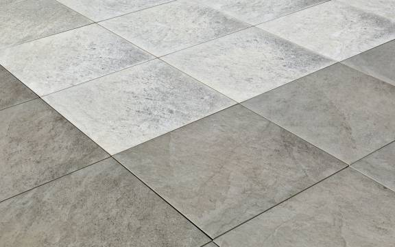 Gray and white diamond-patterned tile floor, angled view.