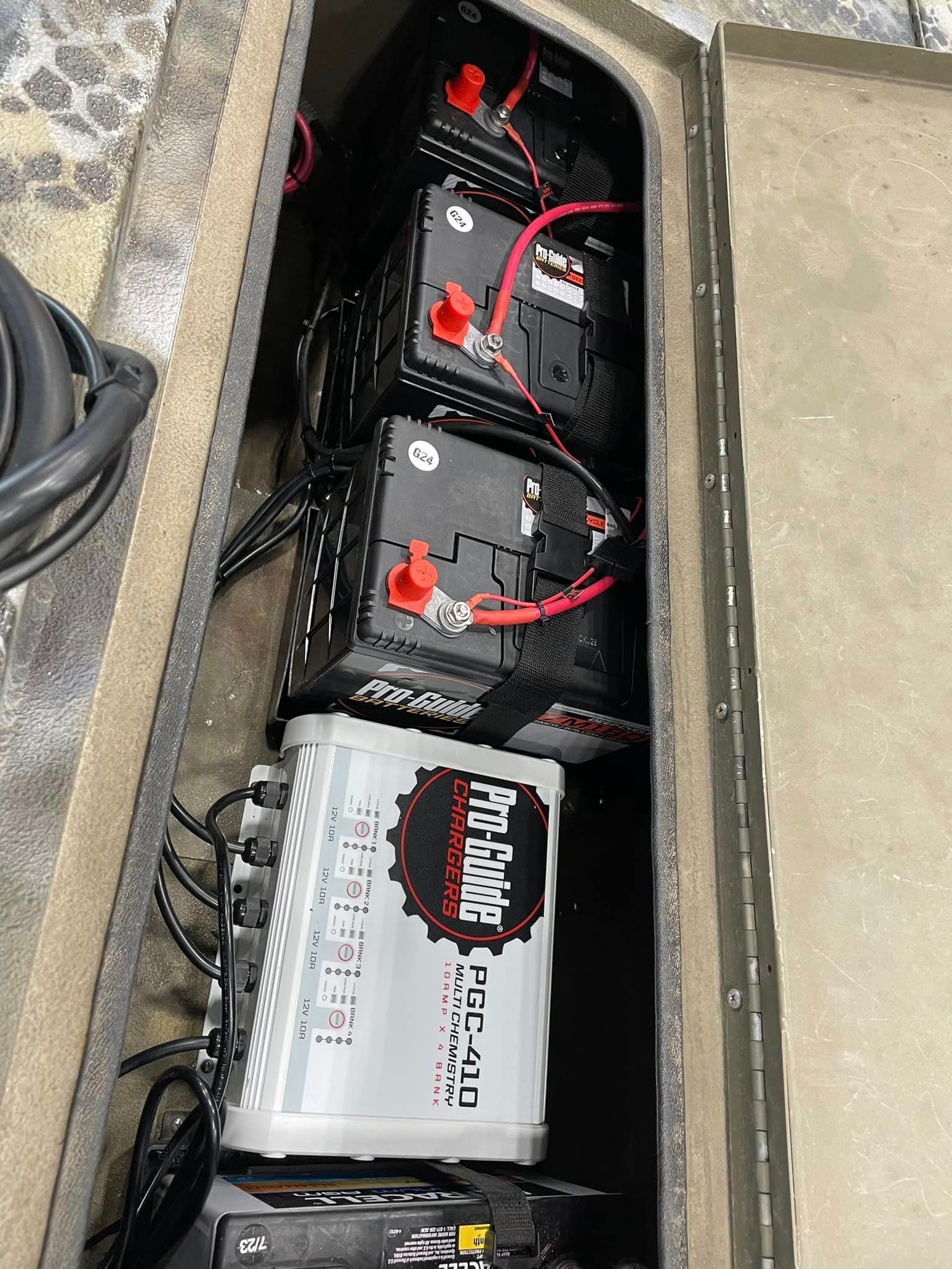 A bunch of batteries are sitting inside of a boat.