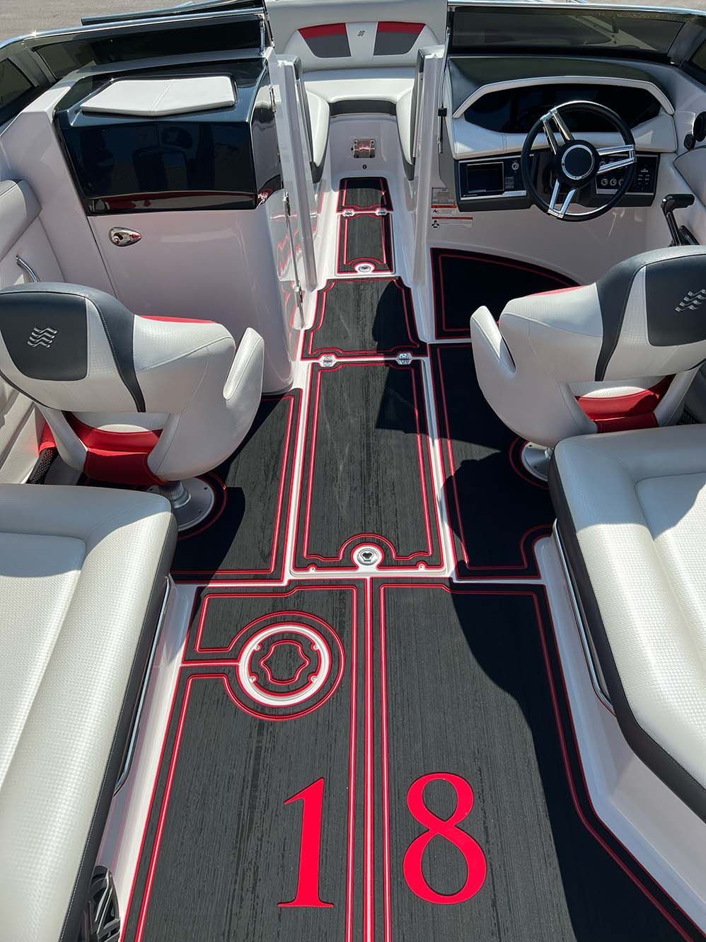 The inside of a boat with the number 18 on the floor.