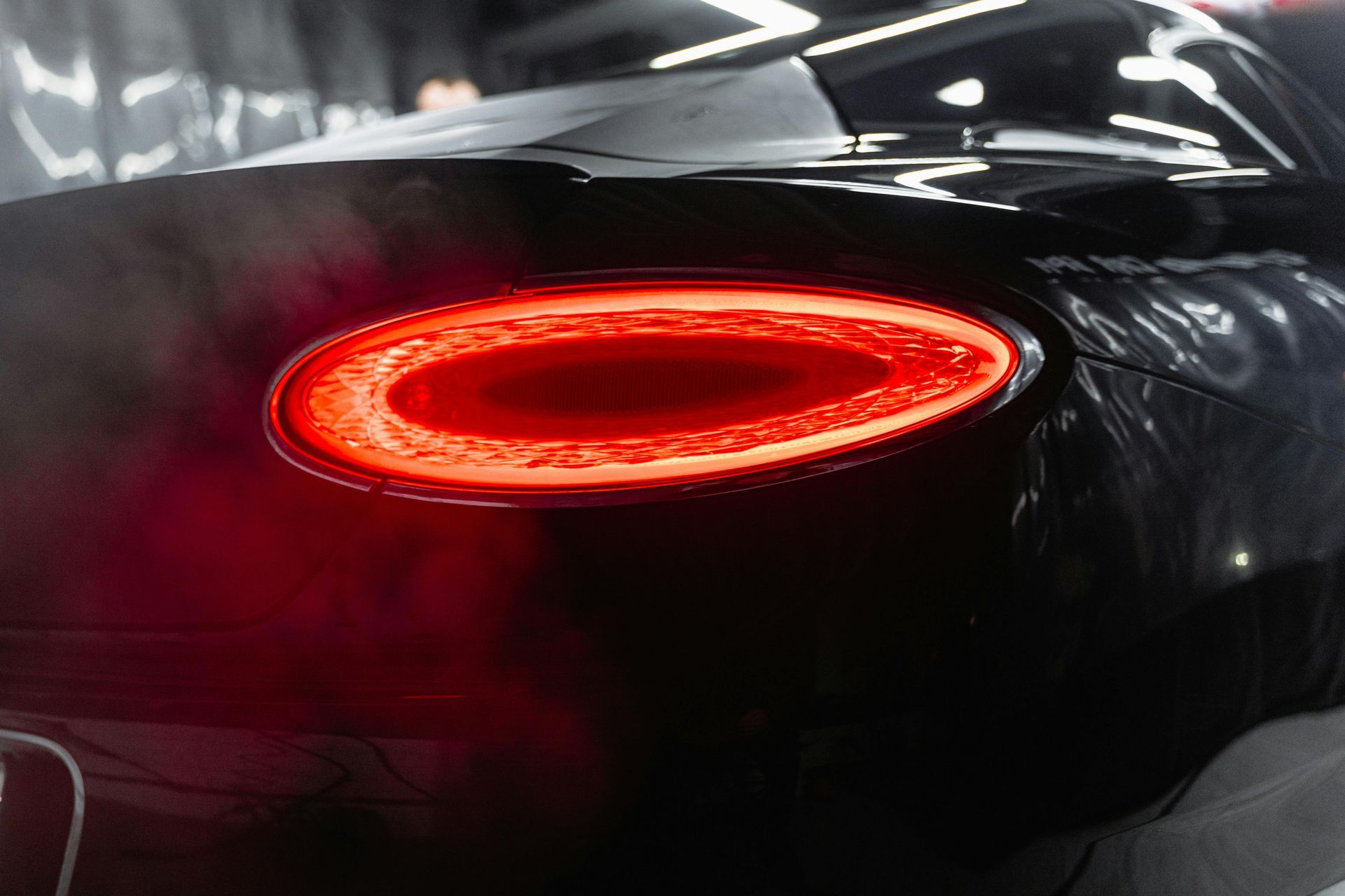 A close up of a bentley continental gt rear light.