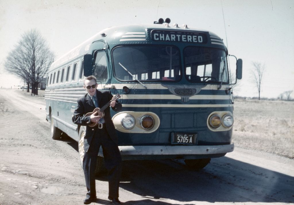 1957: Fred DeNure, DeNure Tours founder, in front of his uncle's bus.