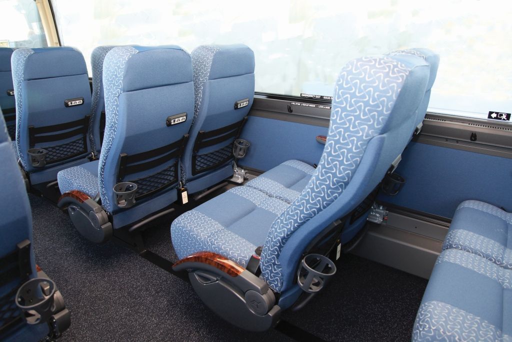 Purple, 48-passenger motorcoach interior