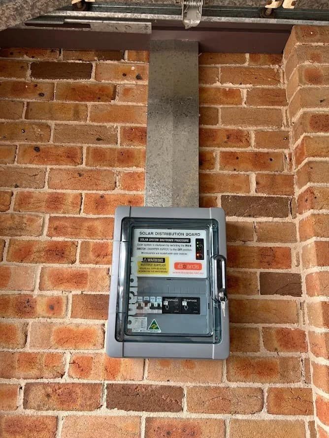 A Brick Wall With a Box Mounted to It — Cool Heat Air Conditioning in Southern Highlands, NSW