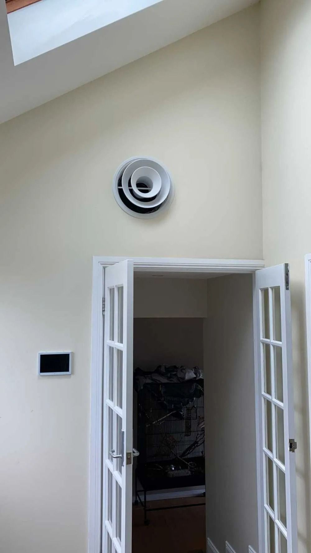 A Doorway Leading to a Room With a Ceiling Fan on the Wall — Cool Heat Air Conditioning in Albion Park, NSW