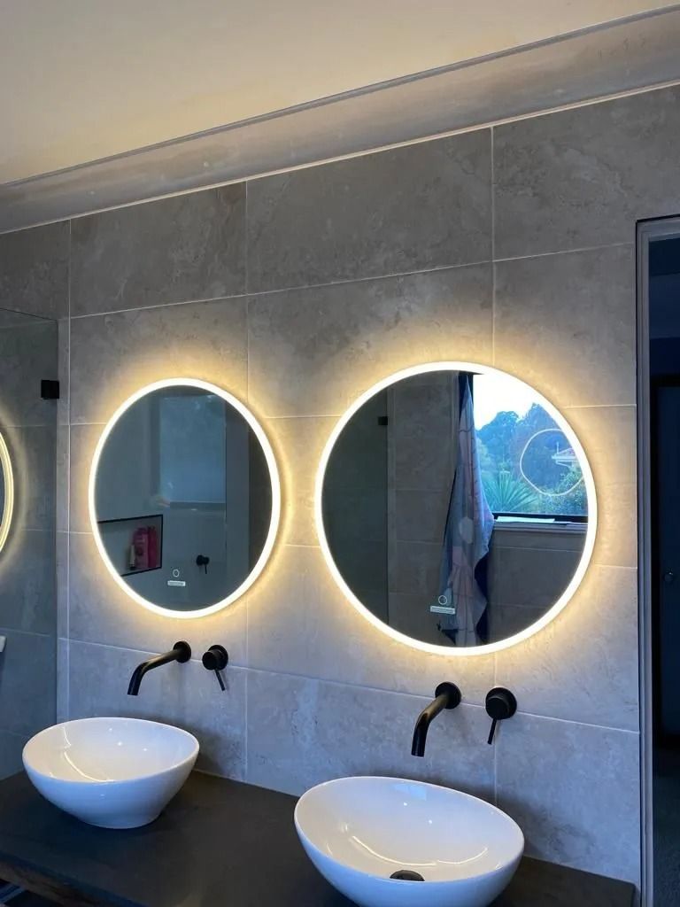 Two sinks with circle mirrors and lights — Cool Heat Air Conditioning in Albion Park, NSW
