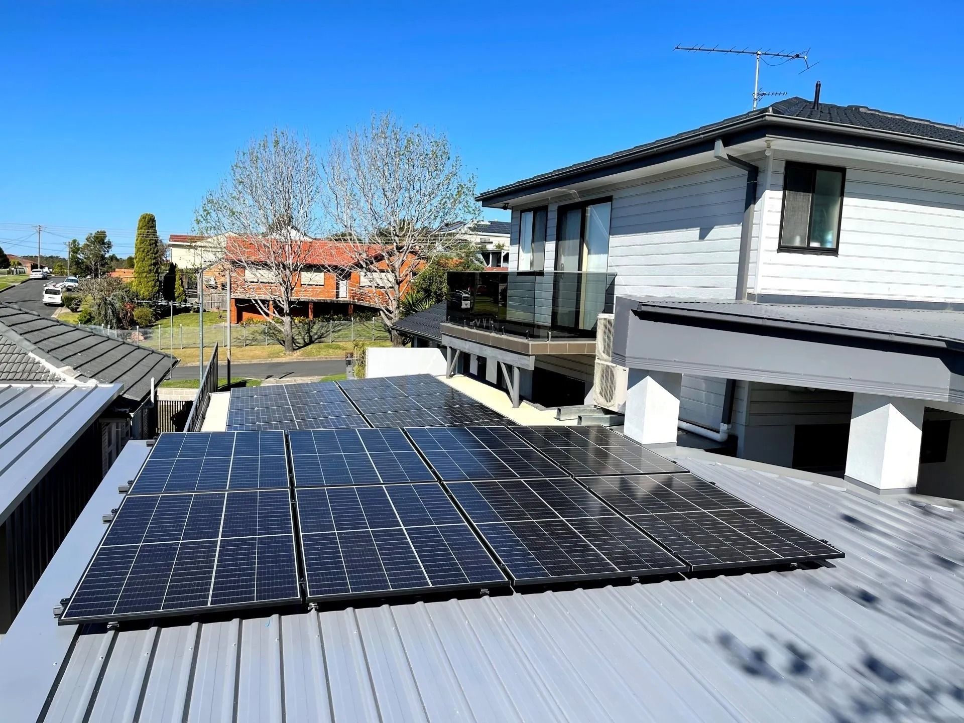 There Are Many Solar Panels on the Roof of a House — Cool Heat Air Conditioning in Albion Park, NSW