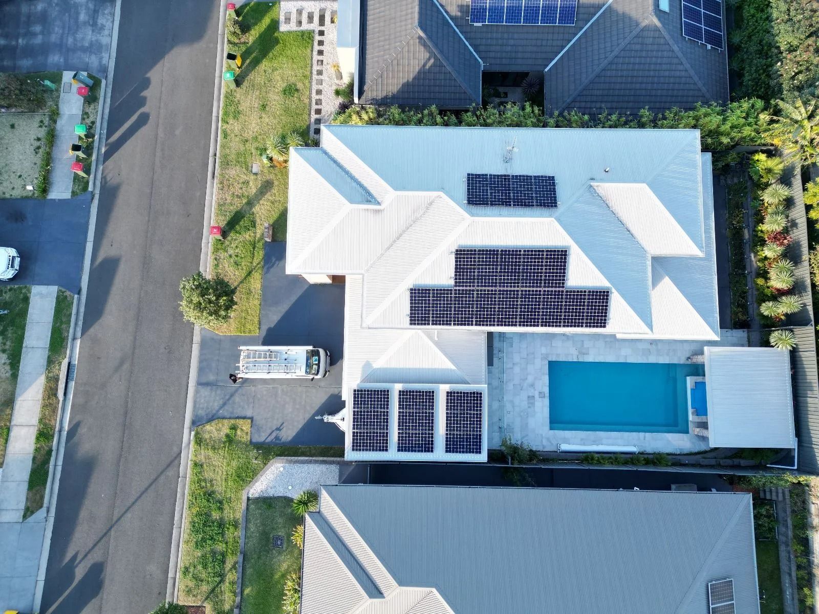 An Aerial View of a House With Solar Panels on the Roof — Cool Heat Air Conditioning in Albion Park, NSW