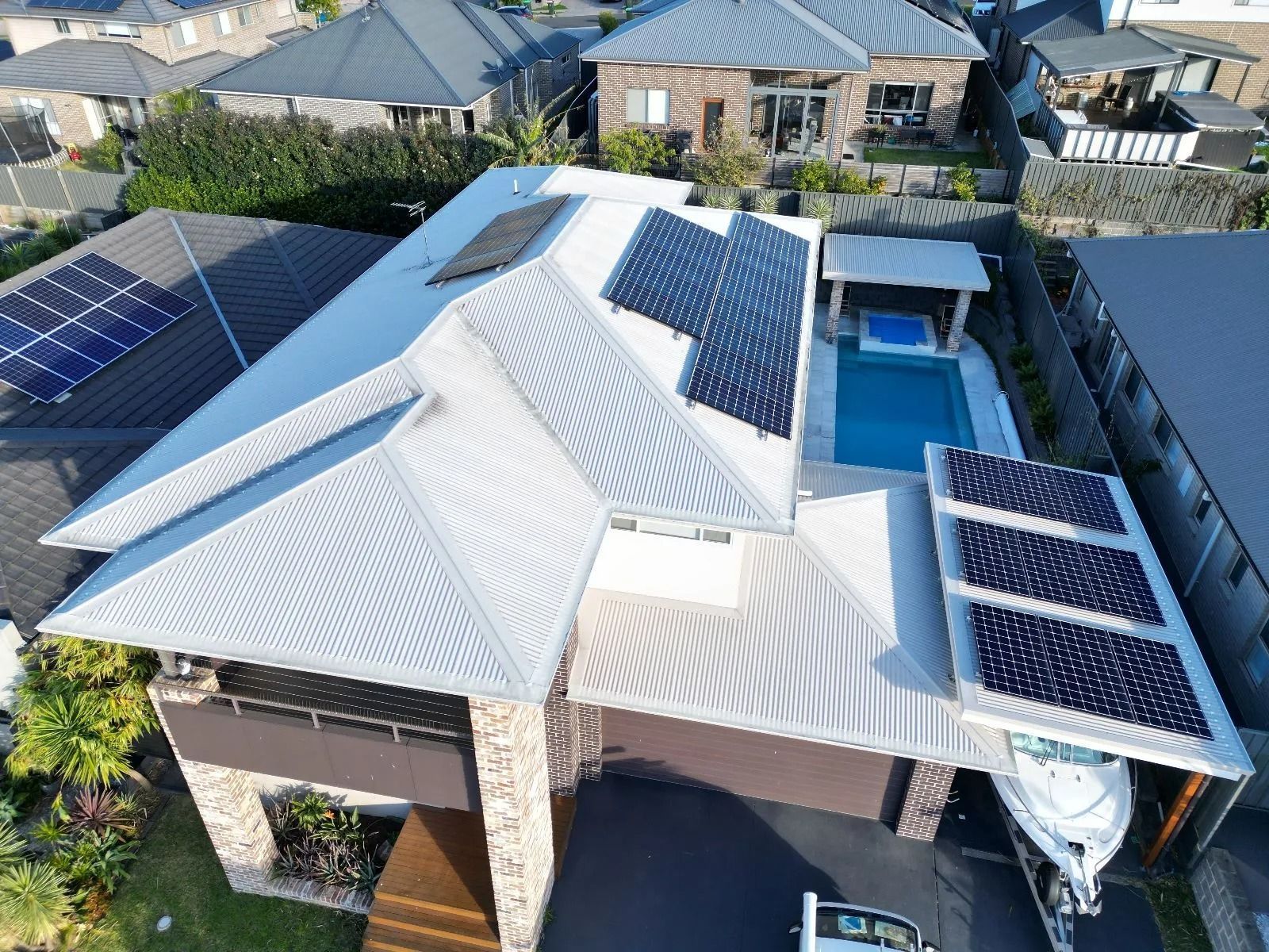 An Aerial View of a House With Solar Panels on the Roof — Cool Heat Air Conditioning in Albion Park, NSW