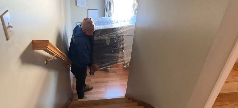 Movers carrying furniture