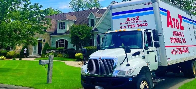 Truck parked outside home for moving to Amherst MA