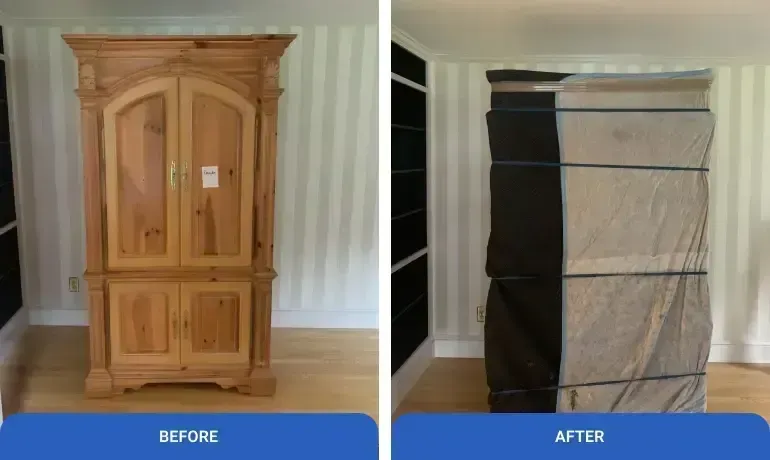 Wooden armoire before and after, with the right side wrapped in protective moving blankets.