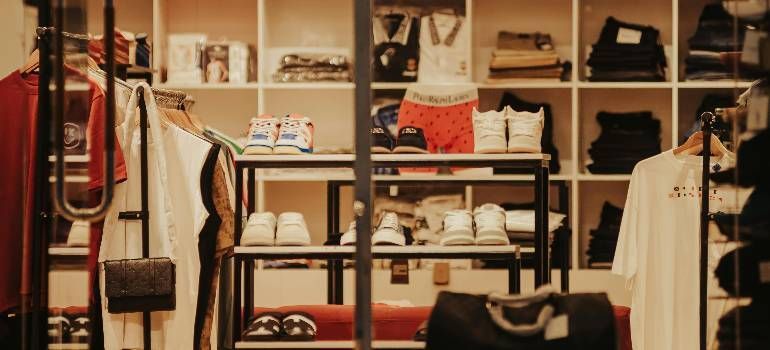 Clothing displays ready after overflow stock gets organized.